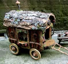 an old wooden wagon with moss growing on it