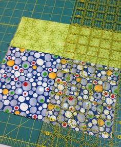 the quilts are being sewn together on the table