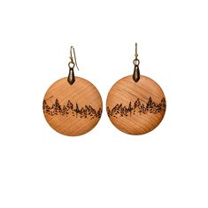 Small Forest Treeline Earrings, from the Horizons collection. Size: 1.5" diameter. 0.5” drop. Material: Available in upcycled and locally sourced hardwoods: Maple, Cherry and Walnut. Adorned with an antique brass pinch bail and hypoallergenic, French hook earrings. Description: Inspired by the forests of the Boreal Shield. Dress them up or dress them down, these earrings are very lightweight and easy to wear. About Burnt Timber Art: Ethical and sustainable wood sourcing. Most of Burnt Timber pro Woodburn Earrings, Timber Art, Burnt Timber, Small Forest, French Hook Earrings, Laser Art, Tree Line, Salvaged Wood, Large Earrings