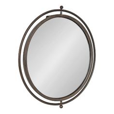 a round mirror with an iron frame and metal ring around the edges, on a white background