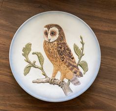 a plate with an owl painted on it