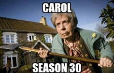 an older man holding a wooden stick in front of a house with the words carol season 30 written on it