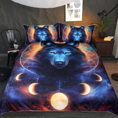 a bed with two wolfs on it and three phases of the moon in the sky