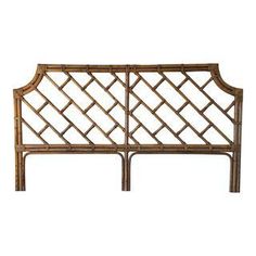 a headboard made out of bamboo with an intricate design