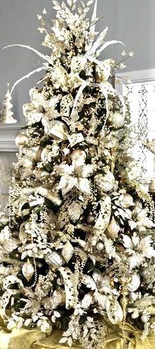 a white christmas tree in a living room decorated with gold and silver ornaments, surrounded by other holiday decorations