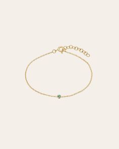 Beautifully handcrafted birthstone of your choice in a 14k yellow gold small mini bezel cup laying on a dainty cable link chain bracelet. Uber chic and timeless bracelet, perfect by itself or stacked. Made in L.A. Total Weight: Approx. 0.7 grams Birthstone Bezel Carat Weight: Approx. 0.03 ctw Available Birthstones: Garnet, Amethyst, Aquamarine, Diamond, Emerald, Alexandrite, Ruby, Peridot, Sapphire, Rose Zircon, Topaz, Blue Zircon Ships in 5-8 business days Rush orders ship in 3-5 business days Due to the nature of this item all stones may vary in color and inclusions making each piece a one of a kind. This item is Final Sale Comes gift ready in a custom Zoe Lev jewelry box Timeless Bracelet, Bezel Bracelet, Link Chain Bracelet, Blue Zircon, Link Chain, Favorite Things Gift, Chain Bracelet, Garnet, Final Sale