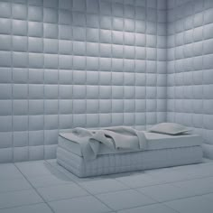 a white bed in a room that looks like it is made out of squares and rectangles