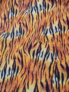 an orange and black tiger print fabric