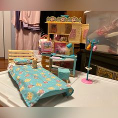 a doll house bedroom with furniture and accessories