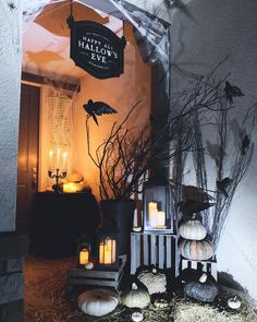 halloween decorations with candles and pumpkins on display