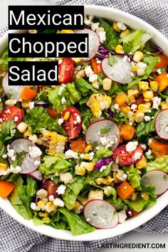 mexican chopped salad in a white bowl with the title above it