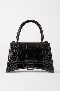 Balenciaga's 'Hourglass' bags are inspired by the label's sculptural blazers. This small tote has been crafted in Italy from croc-effect leather and detailed with a brushed silver 'B' at the front flap. Store your wallet, phone and a paperback inside, removing the adjustable shoulder strap to carry it by the top handle. Balenciaga Mini Bag, Balenciaga Tote, Black Balenciaga, Balenciaga Women, Balenciaga Black, Cheap Bags, Balenciaga Bag, Handbag Straps, Crossbody Tote