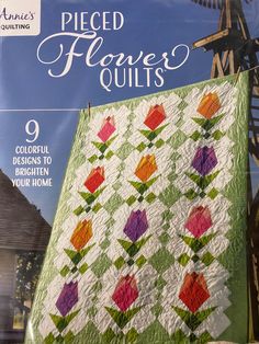 the cover of pieced flower quilts magazine