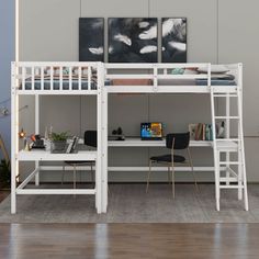 a white bunk bed sitting next to a desk and chair on top of a hard wood floor