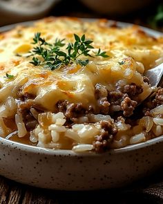 a close up of a bowl of food on a table