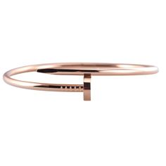 Cartier Juste Un Clou 18k rose gold nail bracelet. Comes with box and service papers. Retail $8000. DESIGNER: Cartier MATERIAL: 18k Gold GEMSTONES: None DIMENSIONS: Bracelet is Cartier size 19, width 15mm. MARKED/TESTED: Cartier, au750, 19, MAJ***. WEIGHT: 35.1 grams CONDITION: Previously Owned/Excellent Condition Cartier Rose Gold Round Bracelet, Classic Cartier Rose Gold Bracelet, Luxury Pink Gold Bracelet For Formal Occasions, Classic Cartier Rose Gold Bracelets, Cartier Rose Gold Bracelet Gift, Luxury Pink Gold Bracelets For Formal Occasions, Luxury Rose Gold Bracelet For Wedding, Luxury Pink Gold Bracelet For Formal Events, Luxury Pink Gold Bracelet