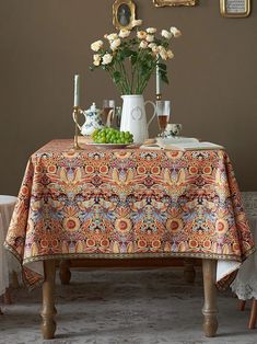 a table topped with a vase filled with flowers