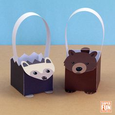 two paper bags that have animals inside of them