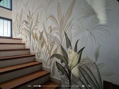 the stairs are painted with flowers and leaves