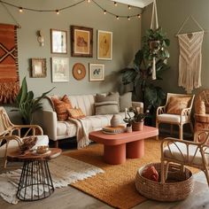 a living room filled with lots of furniture and pictures on the wall above it's coffee table