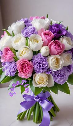 a bouquet of white, pink and purple flowers with a purple ribbon tied around it