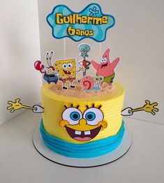 a spongebob themed birthday cake with cartoon characters on the top and bottom tier