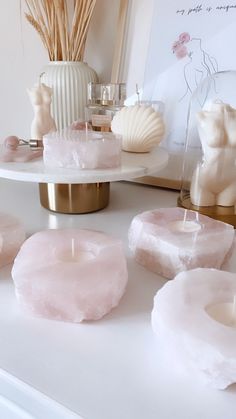 some candles are sitting on a white table