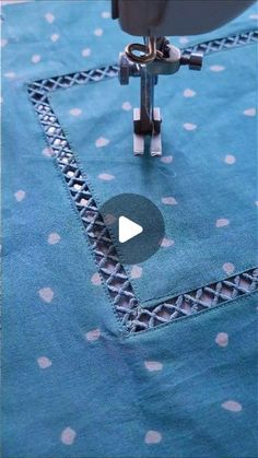 the video shows how to sew an applique on a piece of fabric