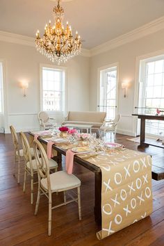 a dining room table is set with place settings