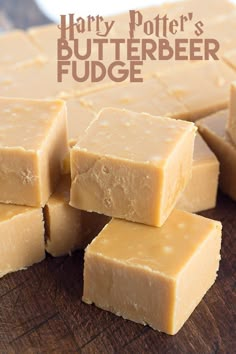 several pieces of brown fudge sitting on top of a wooden cutting board