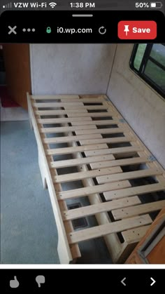 the bed frame is made up and ready to be used as a headboard for a camper