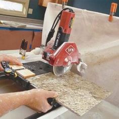 a man using a table saw to cut wood