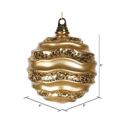 a gold ornament hanging on a white background