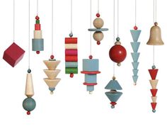 an assortment of wooden toys hanging from strings