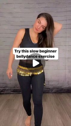 a woman in black top and gold belt with text saying try this slow beginner belly dance exercise