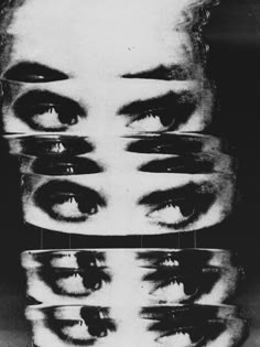 a black and white photo of many different eyes with one person's head in the middle