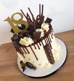 a birthday cake with chocolate and white frosting