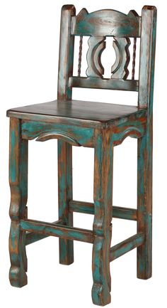 an old wooden chair that is painted blue and has carvings on the backrests