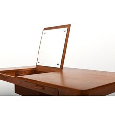 a wooden desk with a mirror on it