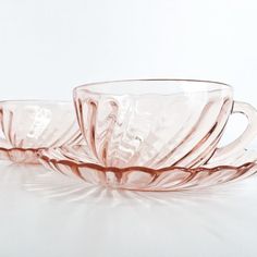 three glass cups sitting on top of each other