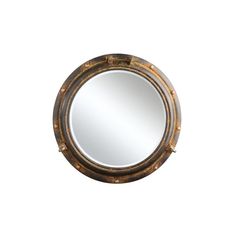 a mirror that is sitting on top of a wall next to a white background with gold trim