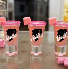 three shot glasses with watermelon wedges and the word bride written on them