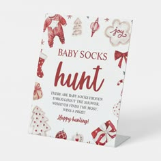 a baby socks hunt card with red and white designs on it's front cover