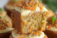 carrot cupcakes with cream cheese frosting and sprinkles on top