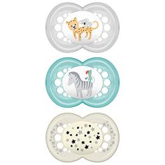 three pacifiers with animals and stars on them