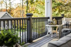 a porch with chairs and tables on it