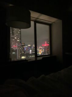 a window view of a city at night