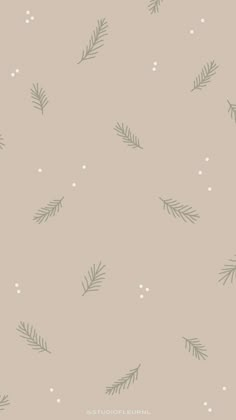 a beige wallpaper with green leaves and snowflakes on the bottom right corner