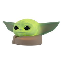 the child yoda toy is glowing green