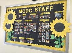 a bulletin board with pictures and sunflowers on it that says mcdg staff